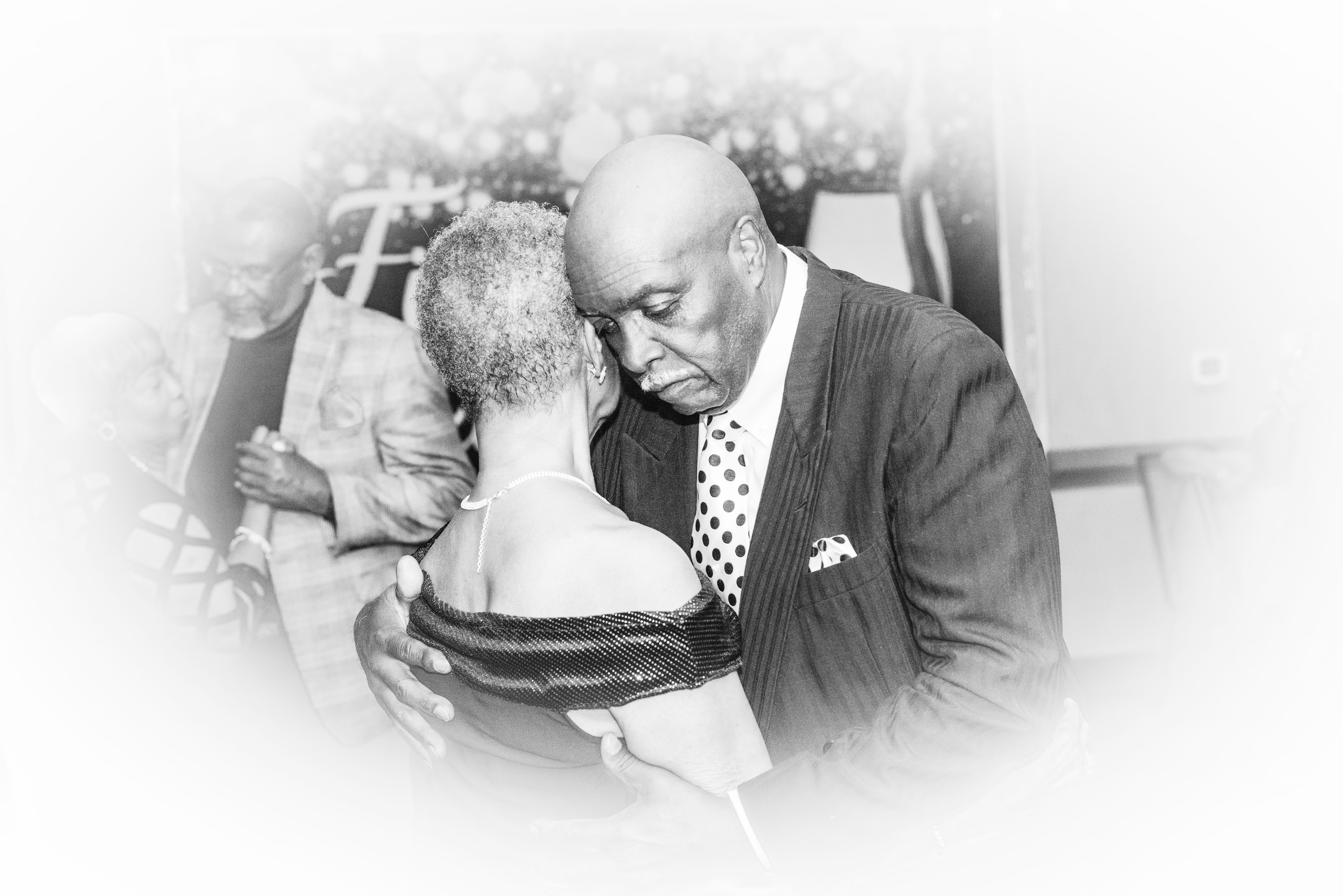 Couple sharing an intimate dance at a formal event