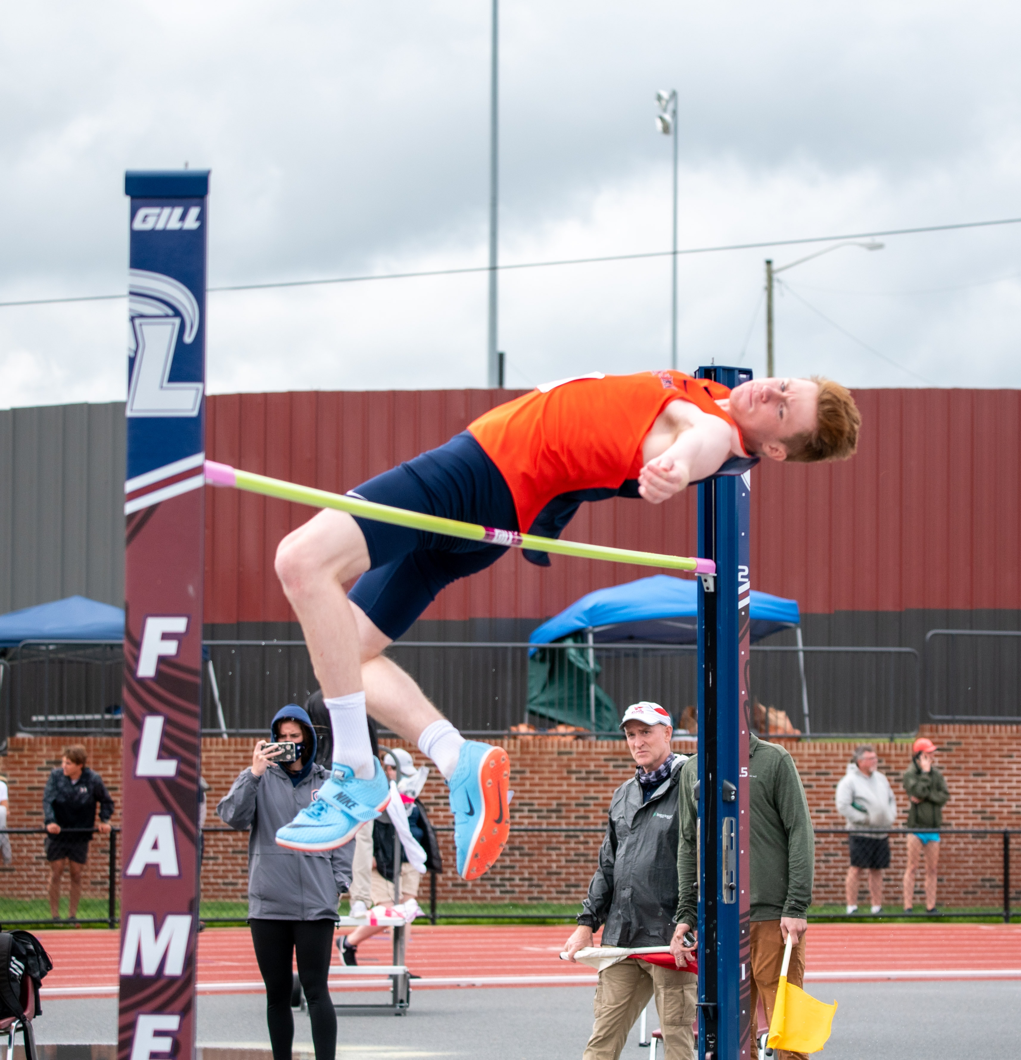 High jumper clearing the bar at a track and field event