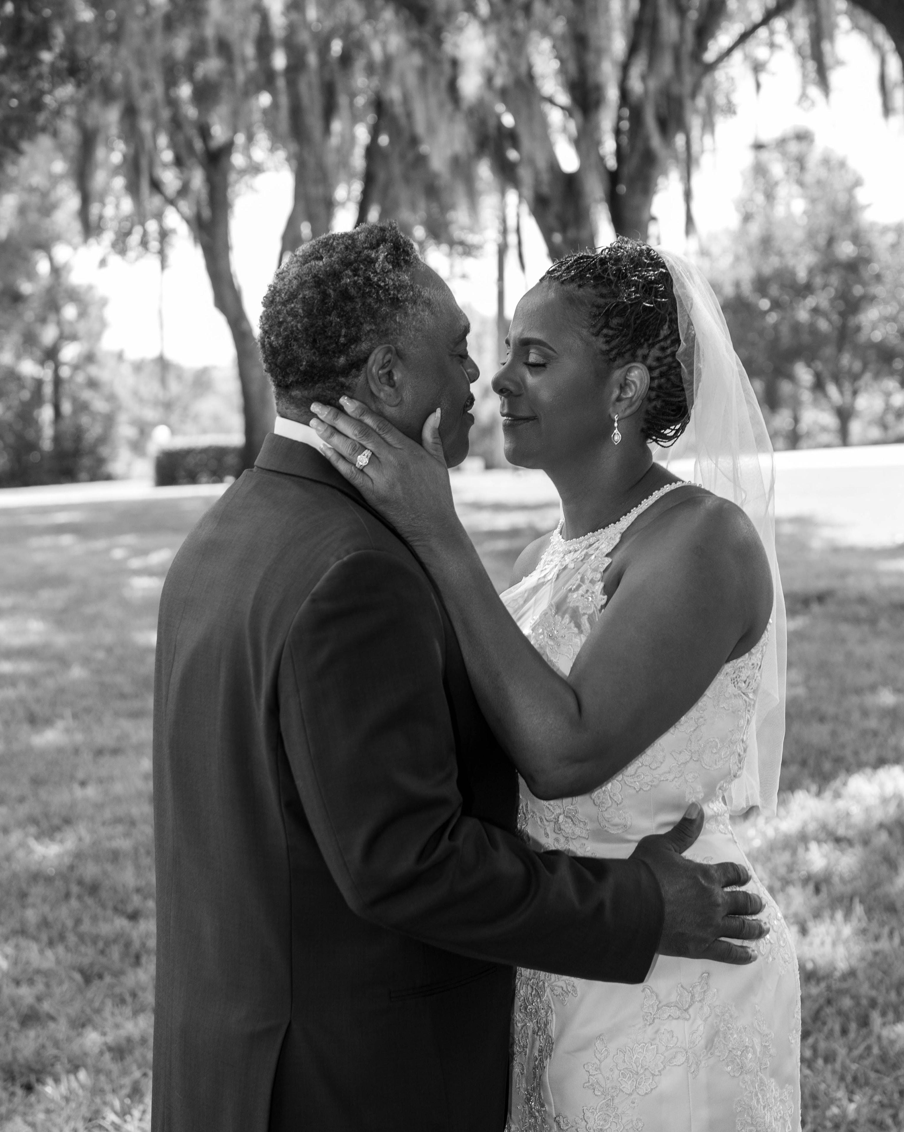 Black and white intimate moment between bride and groom